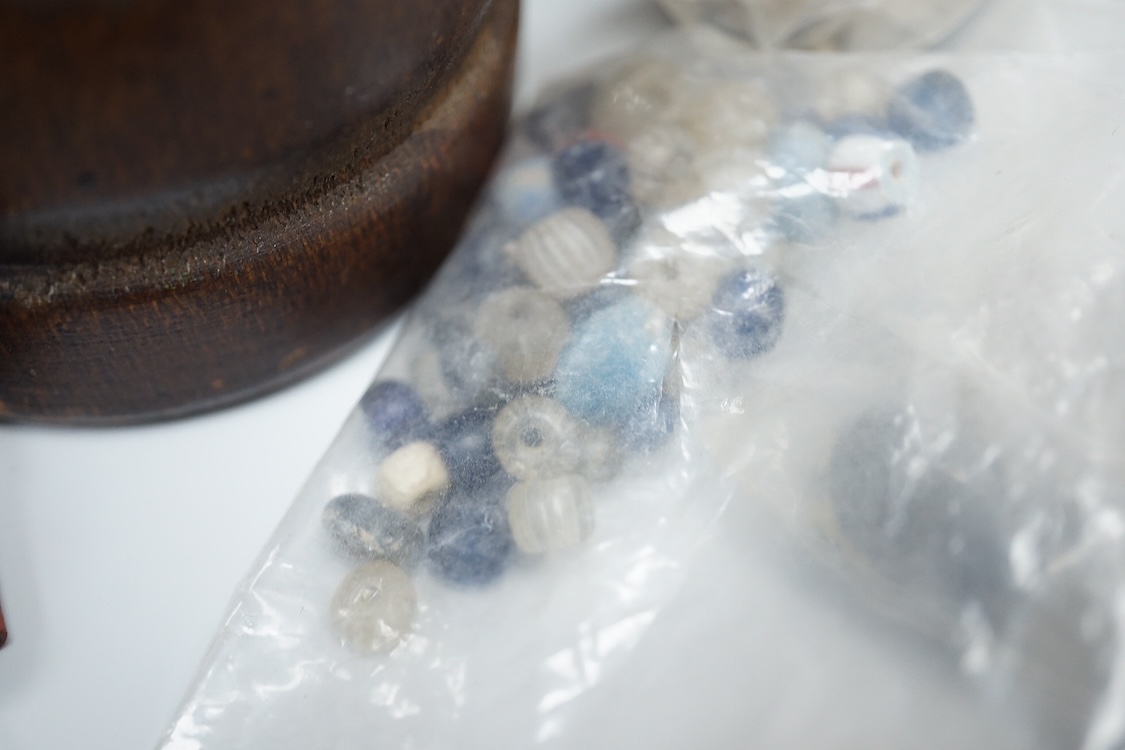 A pair of Turkish bath shoes, a collection of African beads and Middle Eastern vessels etc.